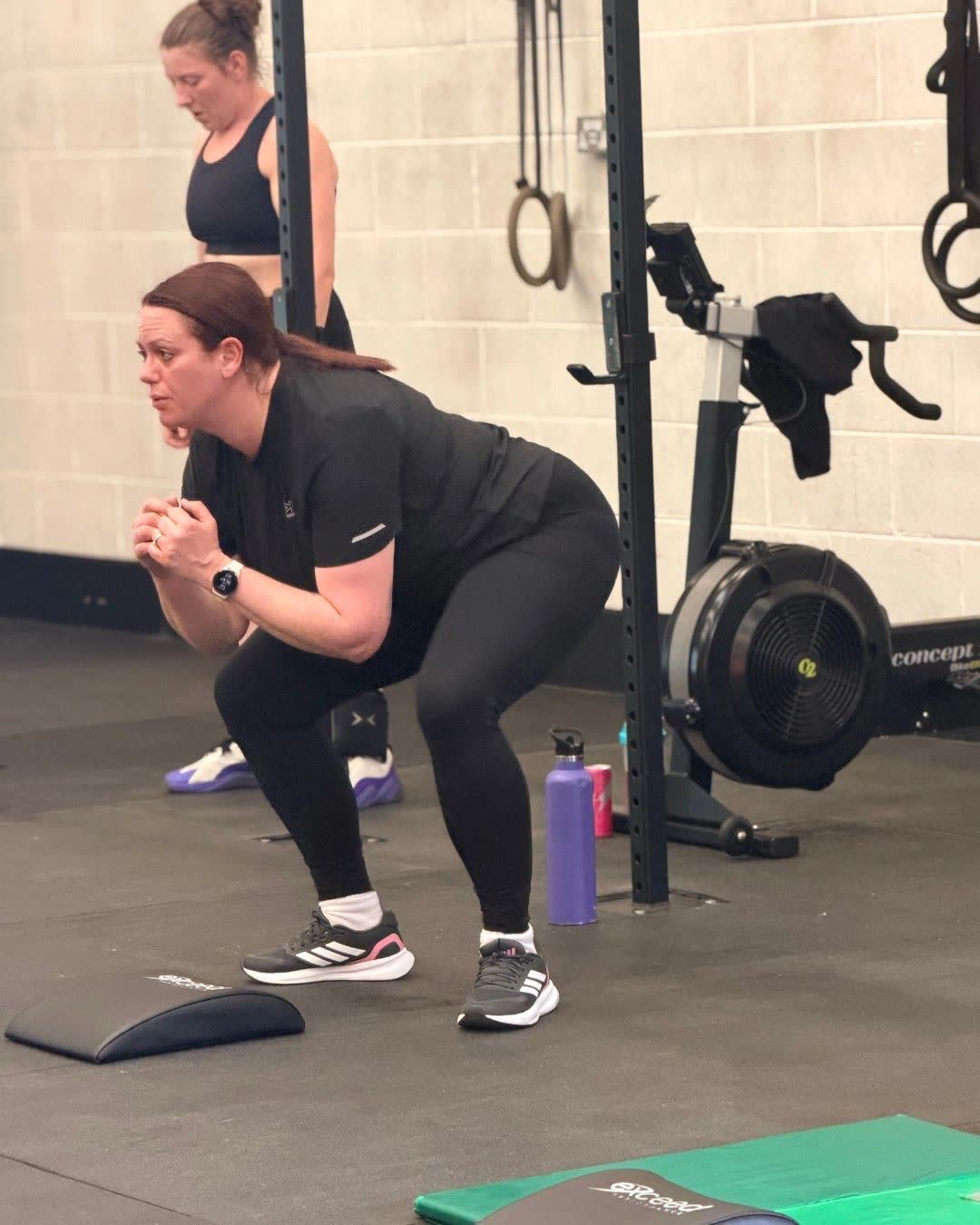 A member squatting during a Couch to CrossFit session