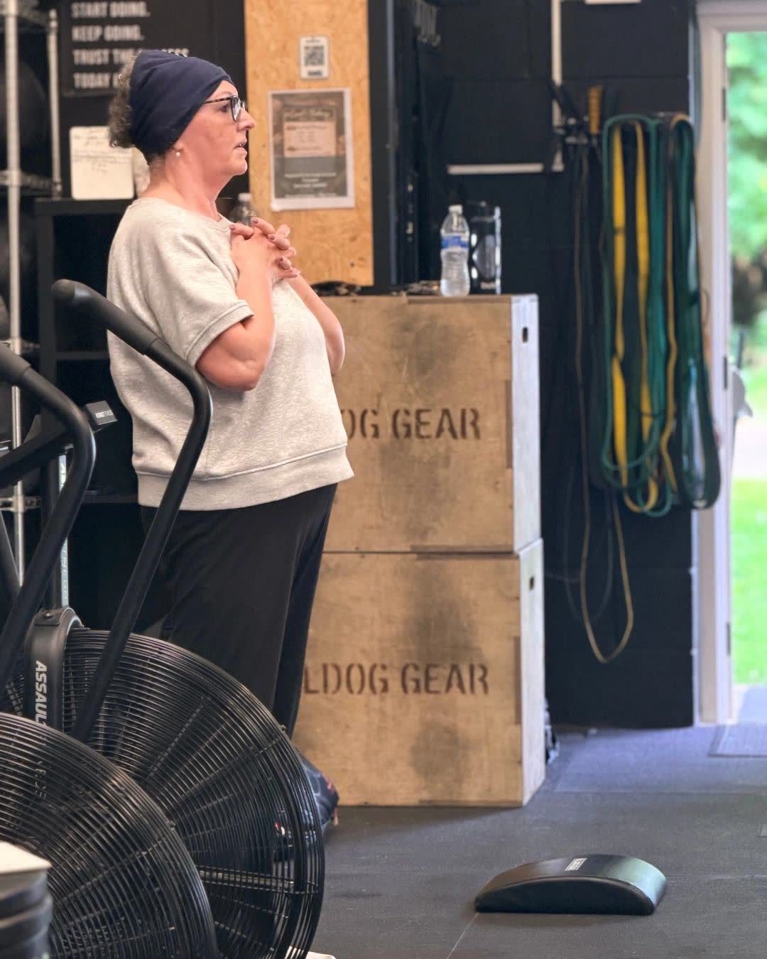 A member catching her breath between exercises